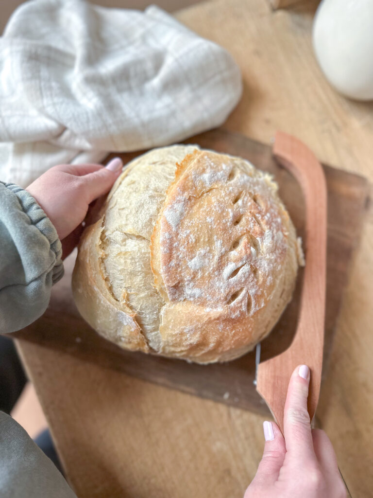 cutting into sourdough loaf 