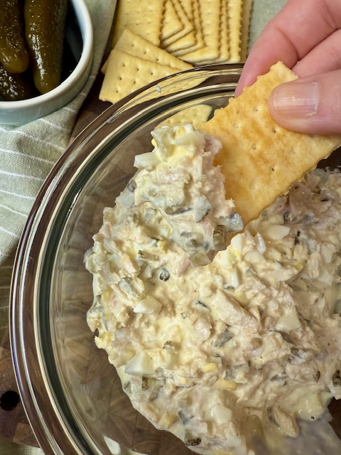 cracker holding tuna salad