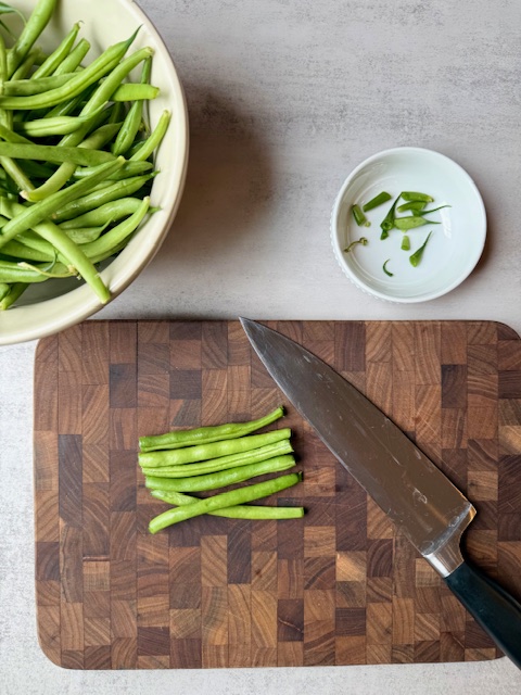 Fresh Green Beans on wood cutting board