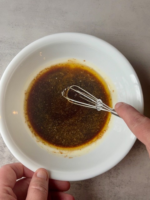Soy sauce mixture in small bowl with whisk