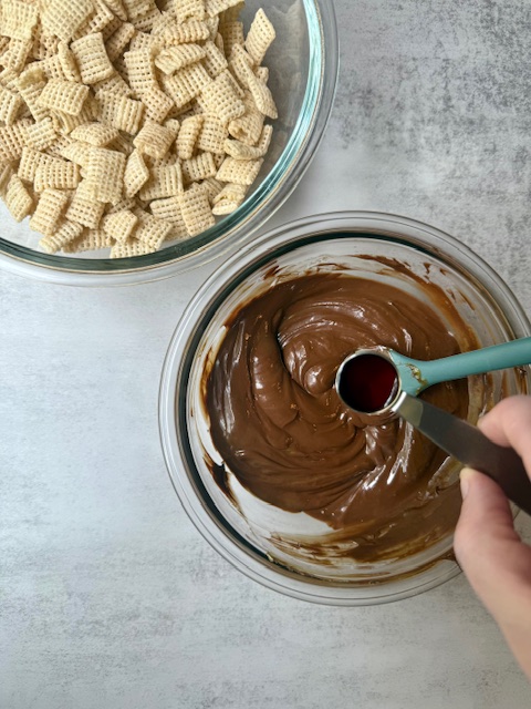 Chex cereal and chocolate mixture in glass bowls