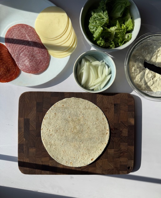 Italian Grinder tortilla on cutting board