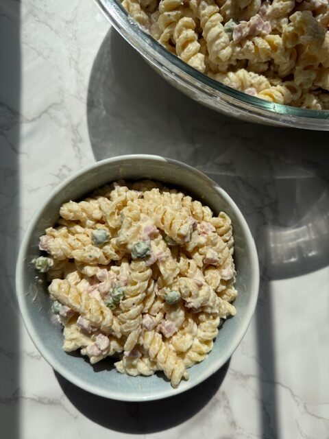 small blue bowl of pasta salad