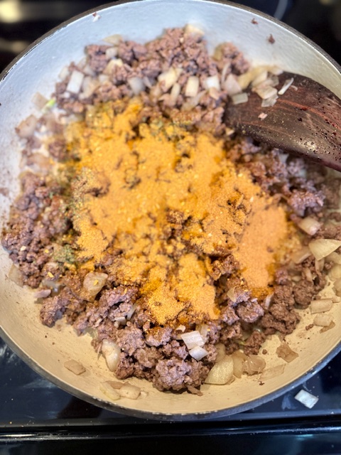 Seasonings on ground beef and onion