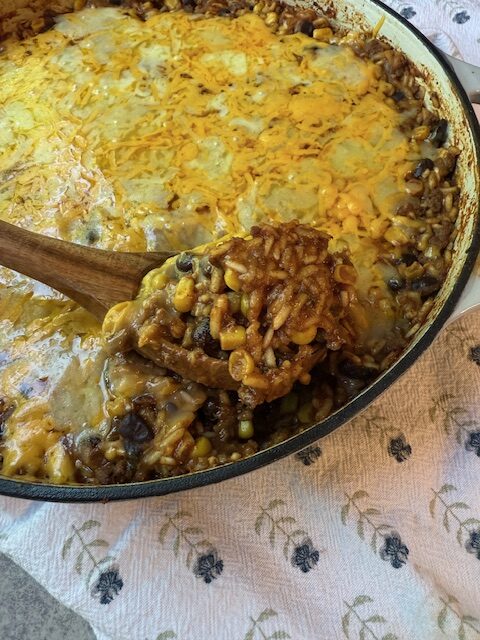 Wooden Spoon scoping Mexican Beef and Rice Skillet