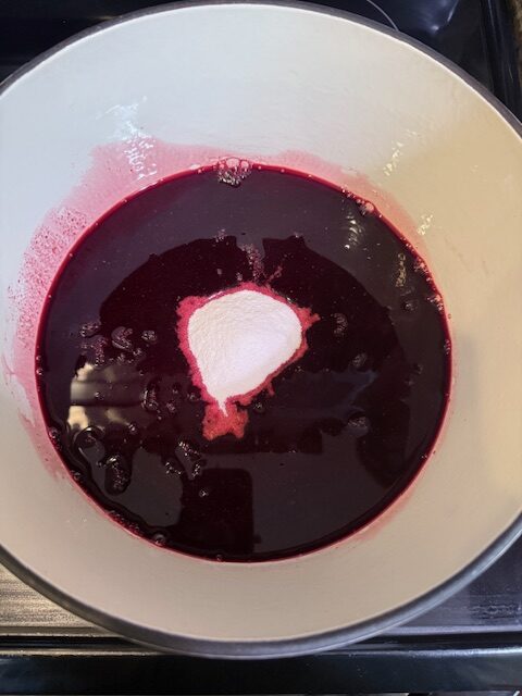 Blackberry juice and sure jell in dutch oven