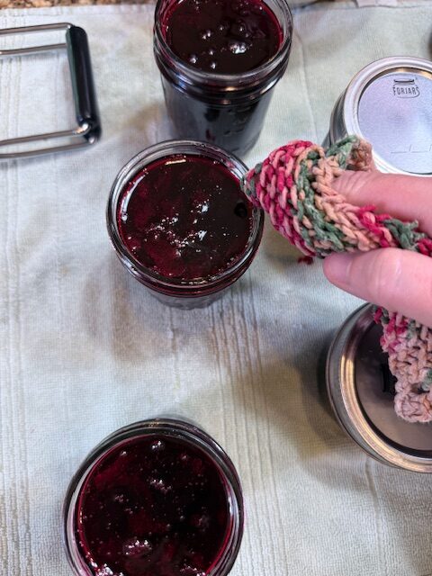 wiping down jars with wet rag