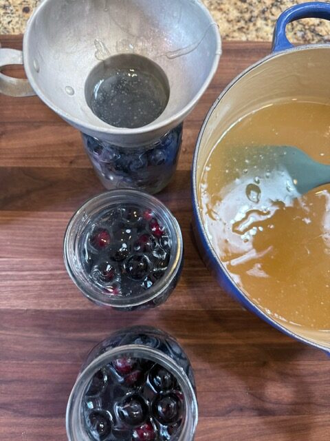 Pouring pie goop into mason jar