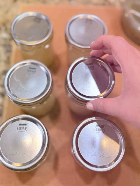 placing lids on jars