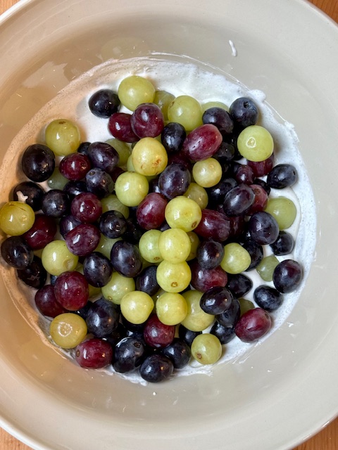 Grapes covered in cream cheese mixture