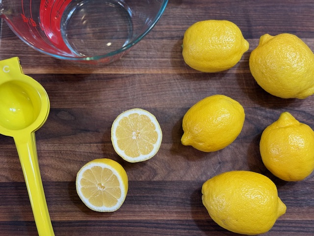 slicing lemons on cutting board
