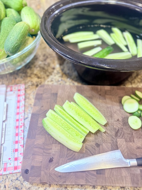 cut pickles on cutting board